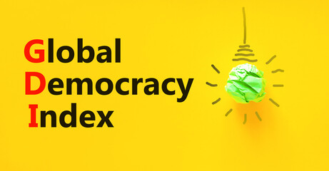 GDI global democracy index symbol. Concept words GDI global democracy index on paper on beautiful...