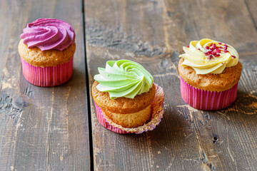 assorted cupcakes on an old wooden table