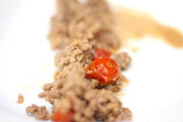 ground beef with selective focus. ground beef with tomatoes. meat with cherry tomato. 
