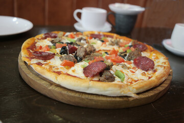 Deluxe Pizza with Pepperoni, Sausage, Mushrooms and Peppers