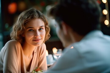 Young couple having a romantic dinner looking at the camera. Generative AI