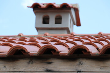 Red tile roof with chimney 