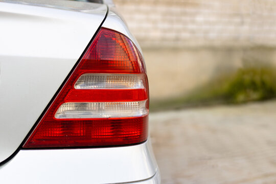 Detail on the Rear or Stop Light of a Car. White Car Brake Light Close up with Copy Space and Background.