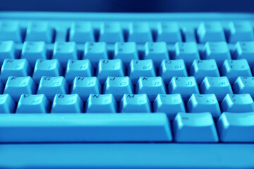 keyboard in blue light, close-up 