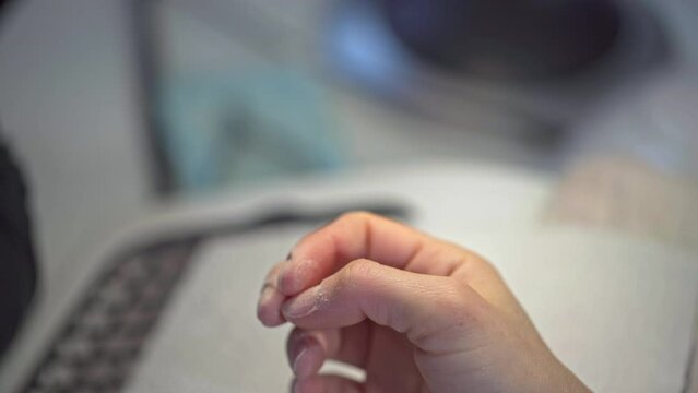Preparation of a thumb nail in a beauty salon