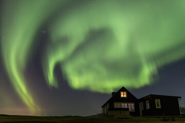 Northern Lights over a cabin in Iceland