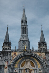 The sanctuary of lourdes with the golden cross