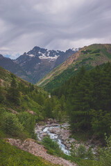 A picturesque landscape of a river flowing through the Alps mountains in the Valgaudemar valley (Les Oulles du Diable)
