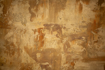 Brown background from decorative plaster with abstract spots. Unusual beige wall texture with...