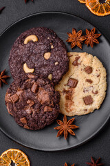 Delicious fresh crispy oatmeal cookies with chocolate and nuts
