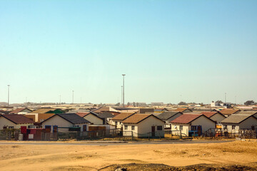 Rows of one-story houses of a small settlement in the desert