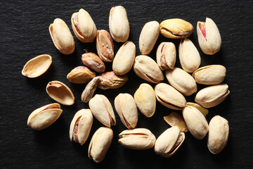 Photography of a handful of roasted and salted pistachios