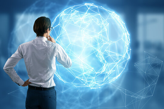 Back view of young man using glowing polygonal globe hud on blurry background. Connection Structure. Digital Data Visualization. Social Network Graphic Concept.