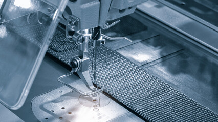 Professional sewing machine and sews garments,  textile fabric production industrial concept...