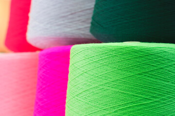 Sewing threads as a multicolored background close up