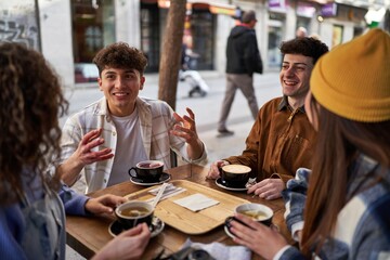 A multicultural group of friends enjoying coffee and tea after their vacation.