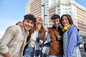 Adventurous group of friends smiling, exploring new city on vacation.
