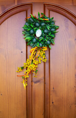 Easter wreath on the wooden door of the house