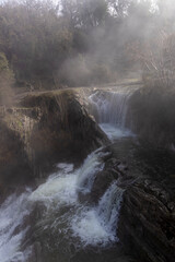 A mesmerizing display of nature: The magnificent Delika Waterfall amidst the misty mountains of Vizcaya