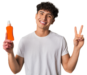 A young latin man holding a solar protection cream joyful and carefree showing a peace symbol with fingers.