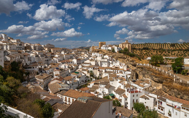 Fototapeta na wymiar Exposure of Setenil de las Bodegas famous for its dwellings built into rock overhangs above the Río Guadalporcún, Cadiz, Spain