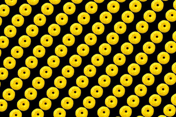 yellow donuts on black background small size