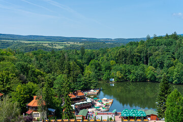SOVATA, ROMANIA - AUGUST 24, 2022: Sovata city and Ursul lake resort. It is known for balneoclimateric and mud treatments. Sovata, Romania on August 24, 2022 - obrazy, fototapety, plakaty
