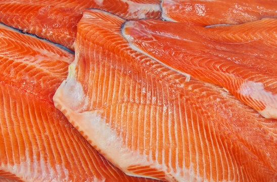 Fresh raw sea food. Fish background. Fresh pieces of red fish in the store.