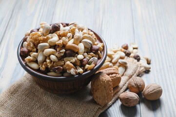 Various nuts on a plate, top view.