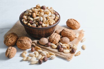Various nuts on a plate, top view.