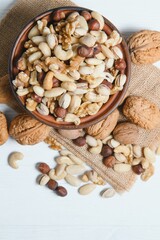 Various nuts on a plate, top view.