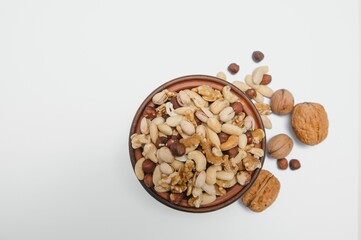 Various nuts on a plate, top view.