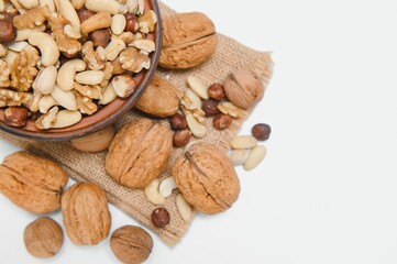 Various nuts on a plate, top view.
