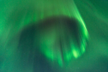 Fototapeta premium An Aurora borealis swirl in the sky near Riisitunturi National Park, Northern Finland