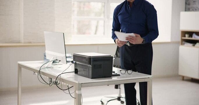 Man Using Photocopy Machine In Office