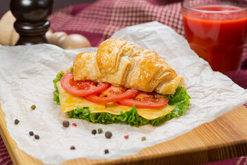 croissant with cheese and tomato