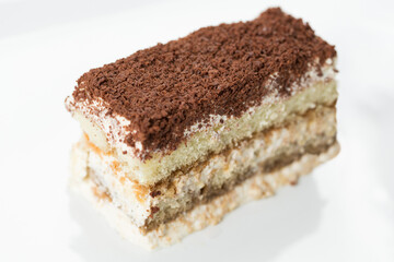 tiramisu, piece of chocolate cake on a plate 