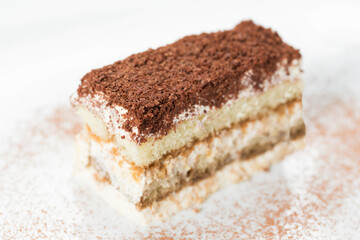 tiramisu, piece of chocolate cake on a plate 