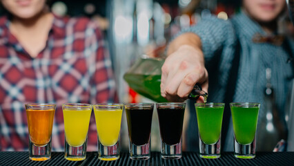 bartender pouring beer in bar