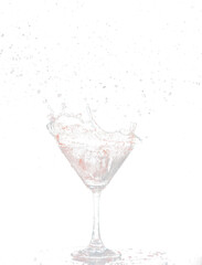 Red Cocktail Glass with splashing water alcohol, Crystal Cocktail drink splatter splash in air and bubble from glass. Liquor Part freeze shot high speed over black background isolated