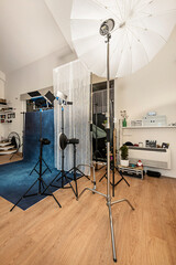 Photography studio with diffusers, backgrounds, spotlights and other paraphernalia