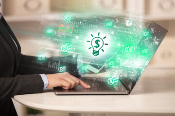 Young man watching stock market on laptop