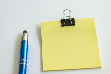 yellow note paper with clip