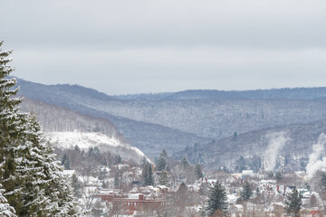 Fototapeta na wymiar Valley town covered in snow, fresh winter landscape, Bradford county, Pennsylvania USA cinematic wonderful copy space image.