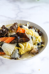 vegetarian fried mixed vegetables in white bowl
