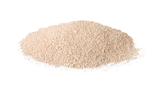Heap of active dry yeast isolated on white