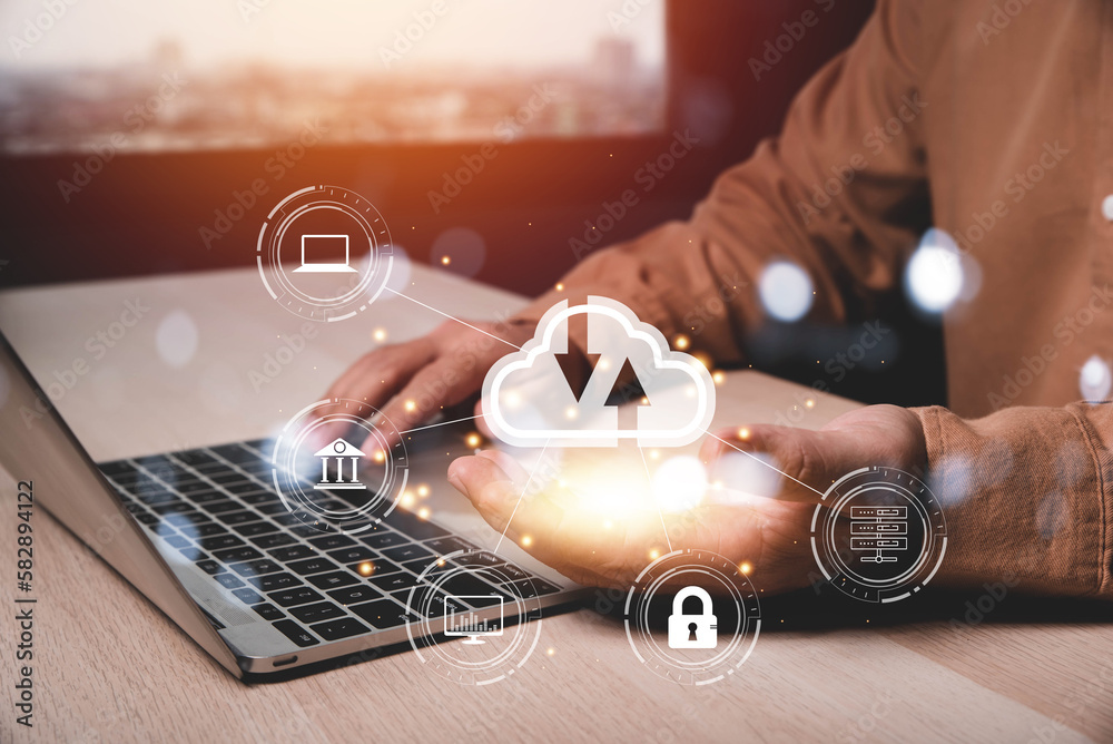 Aufkleber man use Laptop with hand holding cloud computing diagram. Cloud technology. Data storage. Networking and internet service concept , Internet of Things