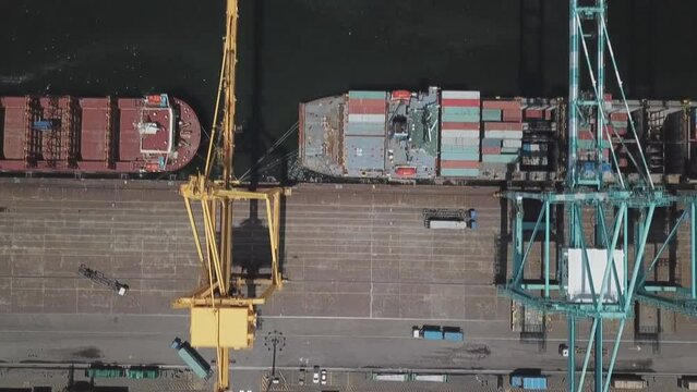 Cargo terminal for transshipment of grain, containers and other cargoes. Jeddah Port, Saudi Arabia. (aerial photography)