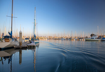 Channel Islands harbor reflections at afternoon sunset in Port Hueneme California United States