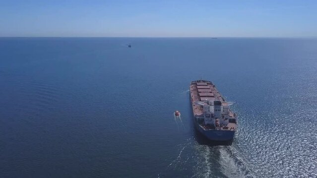 Aerial view of a cargo ship, bulk carrier in the Persian Gulf.